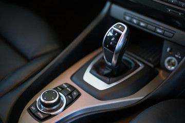 Obraz na płótnie Canvas Detail of modern car interior, gear stick, automatic transmission in expensive car