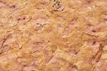 Beautiful old red stone wall texture background.