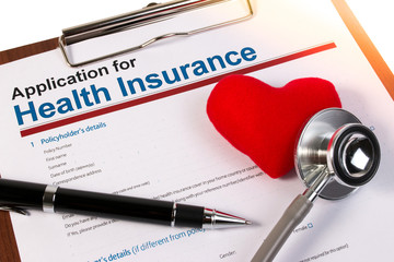 Application form for health insurance, paperwork, questionnaire with pen, heart and stethoscope. Health insurance service with heart concept.