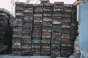 Beijing , China - Dec 21, 2014: colorful crates massive stacked on wooden pallets in a market. the pallets shown the name of owerns