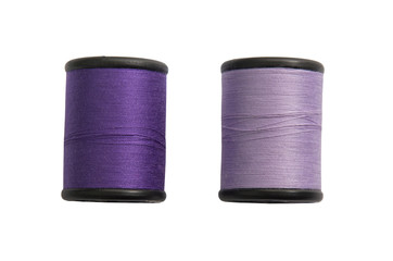 Thread bobbin isolated on white background.