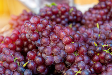Fresh Red wine grapes or dark grapes at the fruit market