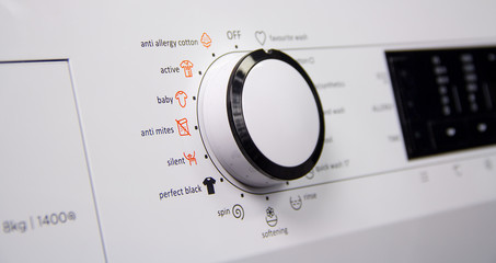 Close up on hand wash button on control panel of washing machine