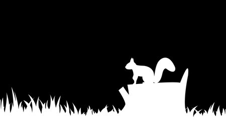 Silhouette of a squirrel on a tree stump.