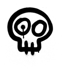 Graffiti emoji skull sprayed in black on white