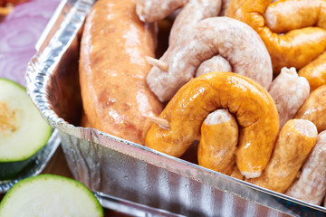Marinated meat and vegetables prepared for grilling