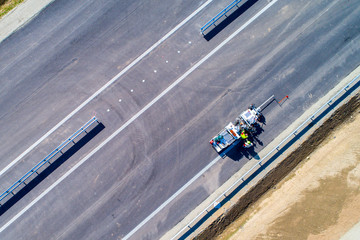 Workers painting the lines