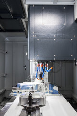 High precision CNC machining center working, operator machining automotive sample part process