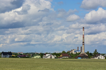 Fototapeta na wymiar Power plant in the background of beautiful clouds 