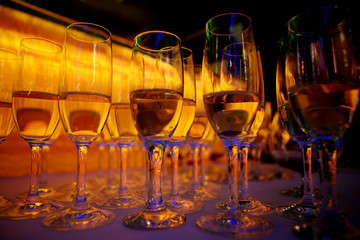 The order of wine glasses on an amber background