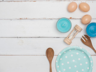 Top view empty color dish, fork and spoon on wooden table.Color dish has pattern  dot.