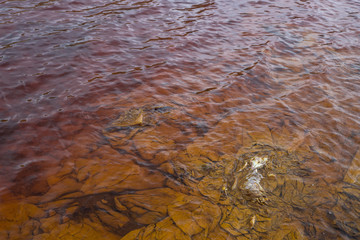 Red artificial lake and hills