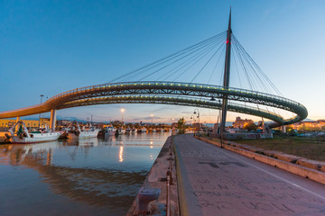 Pescara, Italy - The Ponte del Mare bridge at the dusk, in the canal and port of Pescara city, Abruzzo region
