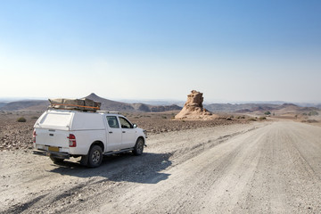 Fototapeta na wymiar 4x4 travelling through Damaraland, Namibia.