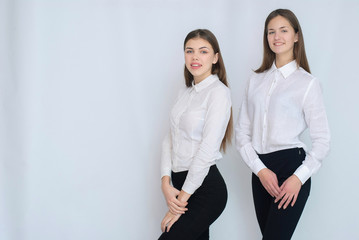 two business models standing with their backs together