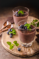 Chocolate pudding with berries and herbs