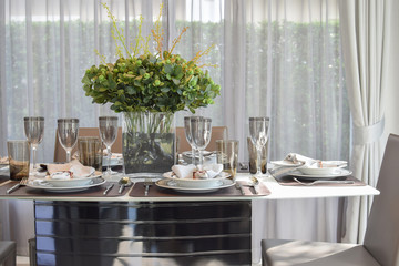 elegant table set in modern style dining room interior