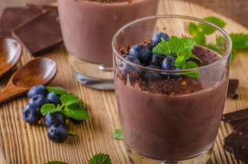 Chocolate pudding with berries and herbs