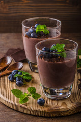 Chocolate pudding with berries and herbs