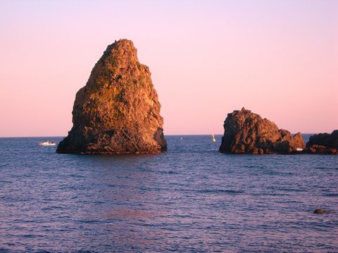 Italy, Sicily: Acitrezza Rocks.