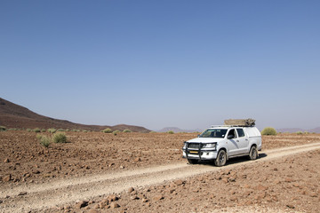 Obraz na płótnie Canvas 4x4 travelling through Damaraland, Namibia.