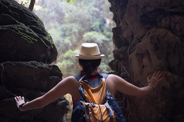 Woman among hills in rainforest