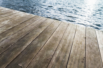 Wooden pier and blue rippled wate