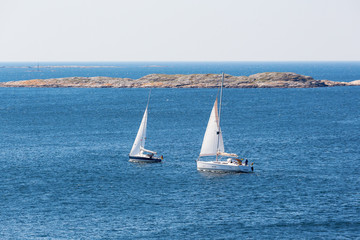 Fototapeta premium Two sailboats sailing on the coast