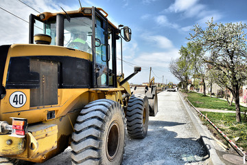 machines and loaders working on as aggregate basis for new road