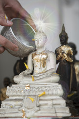 Sprinkle water onto a Buddha image, Season background