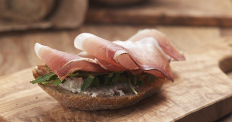 sandwich with italian speck, arugula and cream cheese, 4k photo