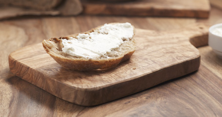 rustic bread with ricotta cheese on wood board, 4k photo