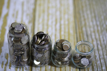 coins stacked in glass jars on the floor russian rubles 