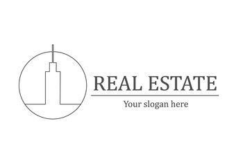 Real estate logo with skyscraper in a circle