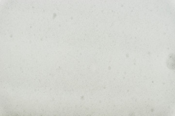 Background soap foam. Fine white soap foam even layer.