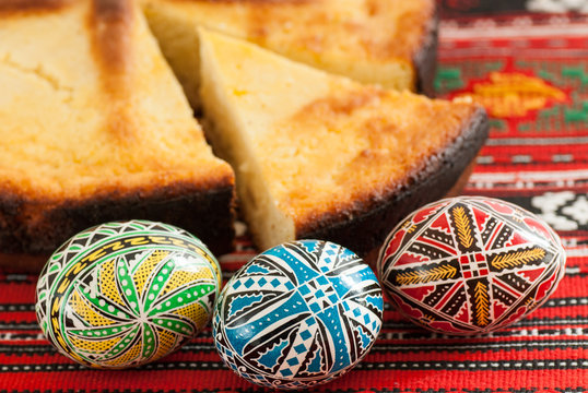 traditional romanian easter bread pasca with cheese and raisins and nicely decorated easter eggs orthodox tradition