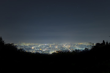 City landscape at night sky with many stars