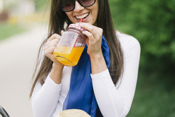 Woman drinking orange juice - 144601789