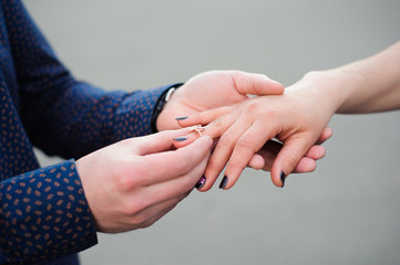 man asking his girlfriend if she wants to marry him