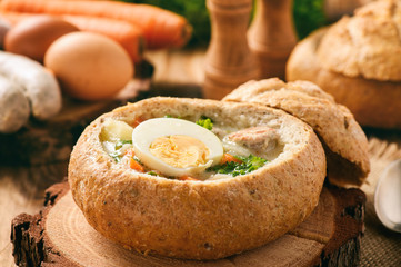Traditional polish  soup - zurek, served in bread loaf.