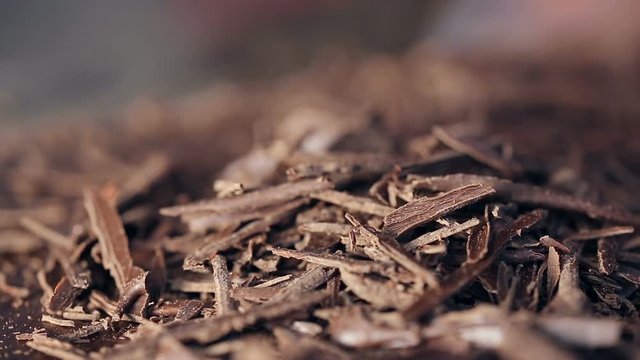 refocusing macro shot on pile of Chocolate chips.