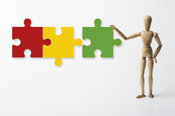 Gliederfigur mit Puzzleteilen