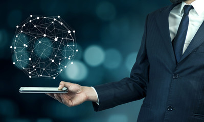 Man hand holding phone with digital Earth planet