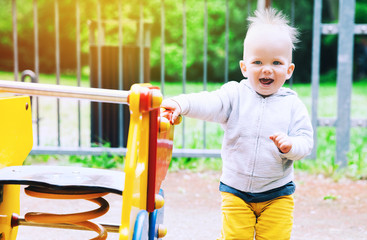 Little Boy Child playing on a playground.