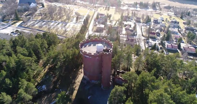 Halikko watertower, Cinema 4k aerial fly away tilt view of Halikko water tower, in Salo, Finland