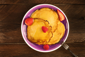 Freshly baked homemade pancakes with fresh fruit