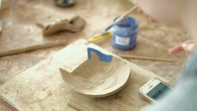 clay potter hands wheel pottery work workshop teacher and girl pupil 4k