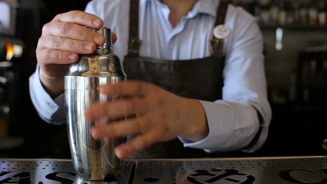 Bartender trains to do the trick in the bar
