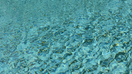 water ripple pattern in pool on sunny day
