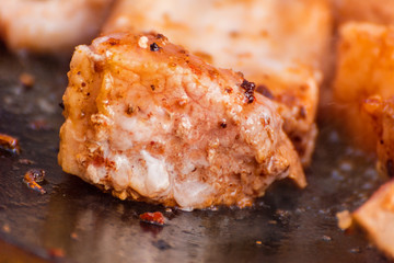 The meat is cooked in a cauldron